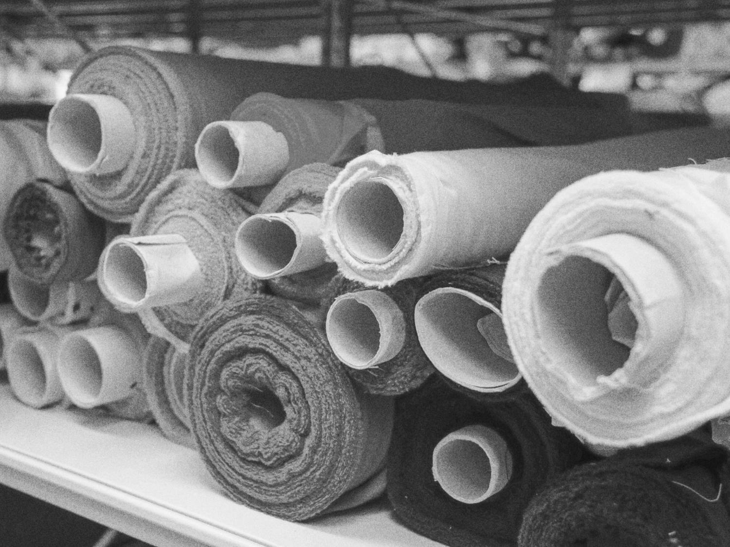 Rolls of fabric stacked at the mill